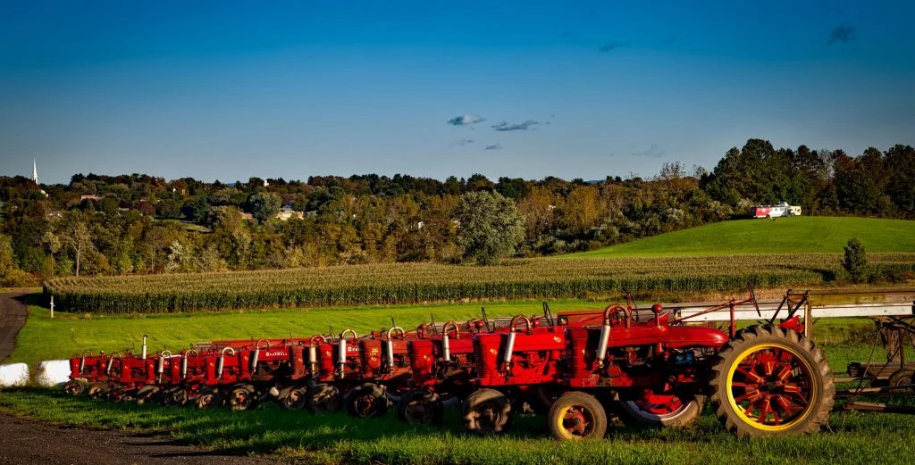 Tractor beside autumn trees